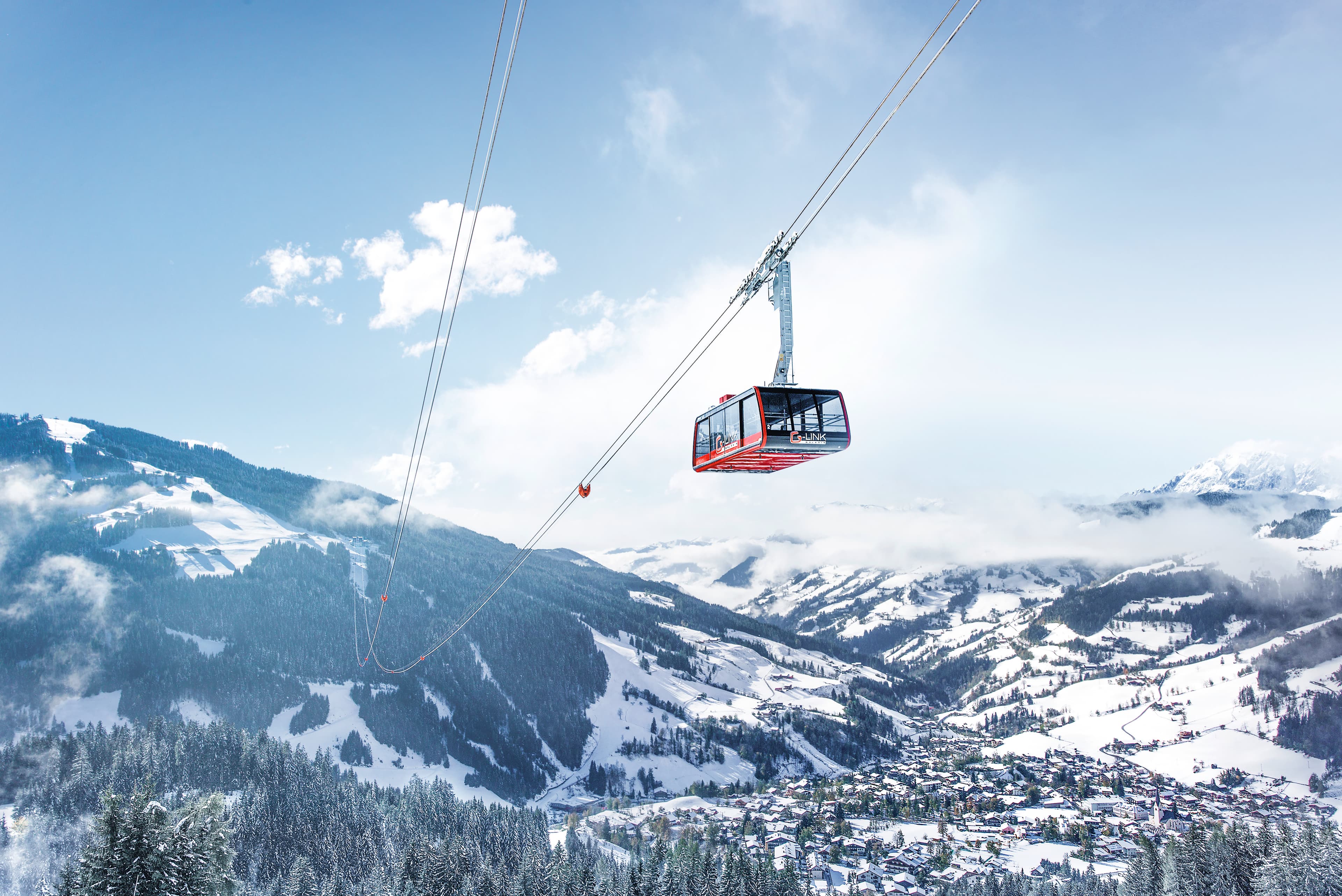 Gondola transporting skiiers to top of mountain